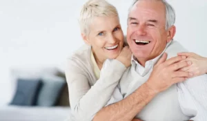 Smiling senior couple feeling secure after choosing final expense insurance to protect their family.