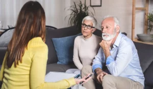 Burial Insurance consultation showing senior couple reviewing simple coverage options despite pre existing health condition concerns.